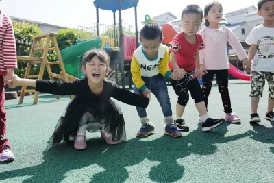 Children play at a kindergarten in Tongren County, Guizhou Province, in 2018.