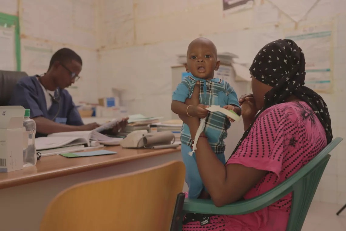 Samba Ba (left), Head Nurse at Ranérou Ferlo, provides essential treatment for a child with malnutrition.